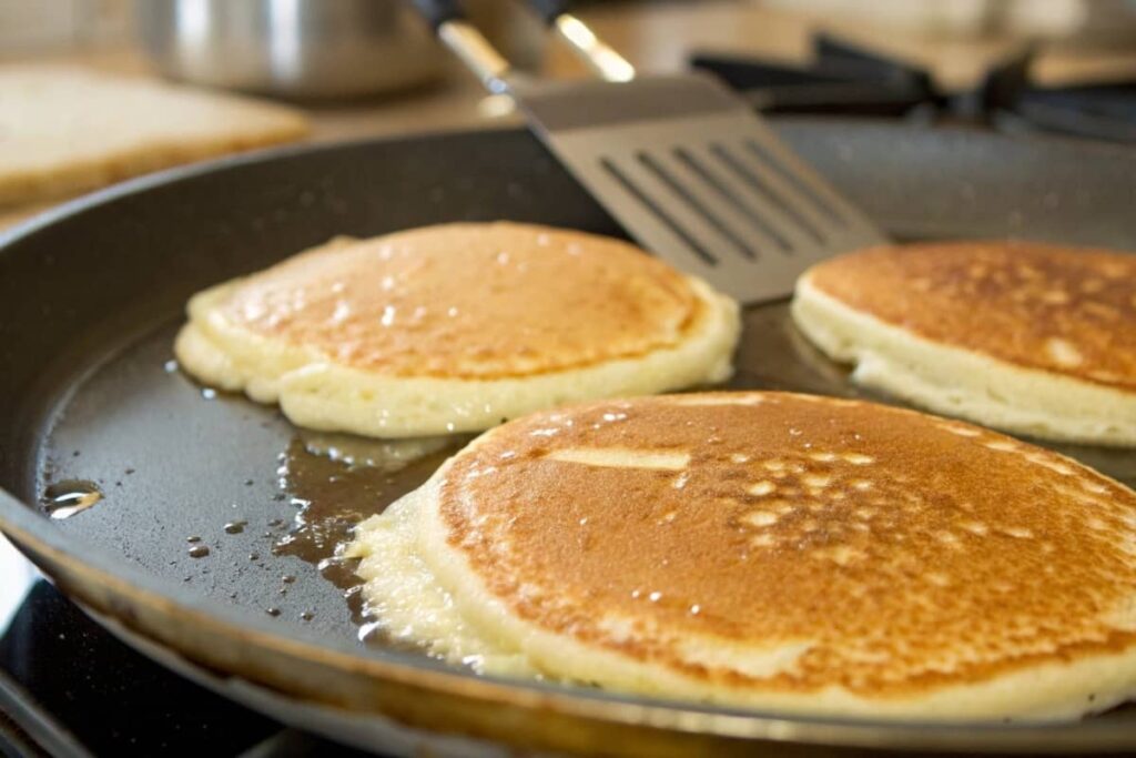 Premier Protein Pancakes Cooking In A Pan.